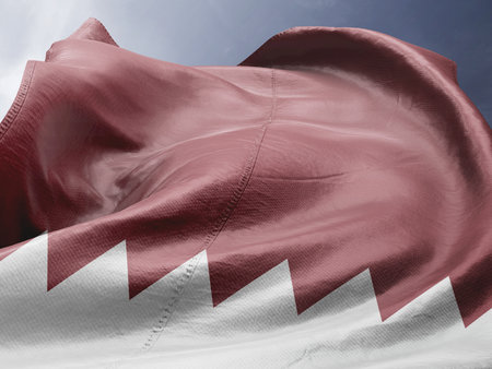 Qatar Flag waving against blue sky with clouds. 3D Render.の写真素材