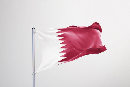Qatar flag waving in the wind isolated on white background. 3d rendering.の写真素材