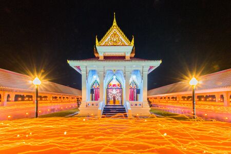 Buddhism Candle Ceremony, Walk with lighted candles in hand around a temple Makhabucha Mar 04, 2015 at Wat Pha NiadLang Suan District Chumphon Thailand.の写真素材