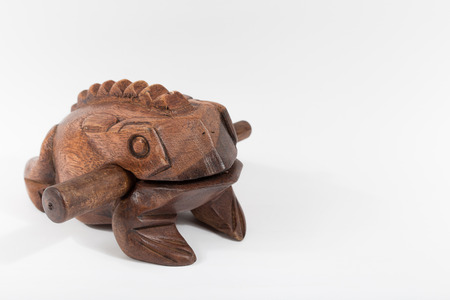 wooden ratchet money toad on white backgroundの写真素材