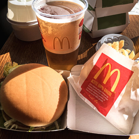 Mcdonalds burger with fries and a beer. Barcelona spain style mcdonaldsのeditorial素材