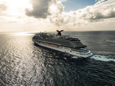 Cruise ship sailing through the caribbean ocean taking all the summer tourists on holiday on the island drone footage aerial viewのeditorial素材