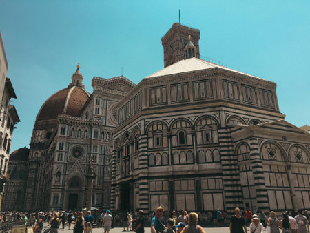 Florence city hall in the middle of town in summer time with people out enjoying the viewのeditorial素材