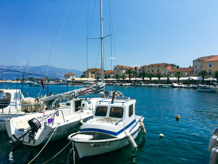 Brac Island Croatia in the middle of summer. With boats and people enjoying summer in the sandy bay.のeditorial素材