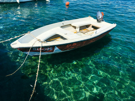 Brac Island Croatia in the middle of summer. With boats and people enjoying summer in the sandy bay.のeditorial素材