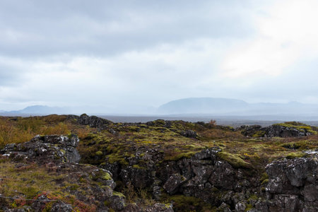 Murky mountains over the green mossy rocksの写真素材