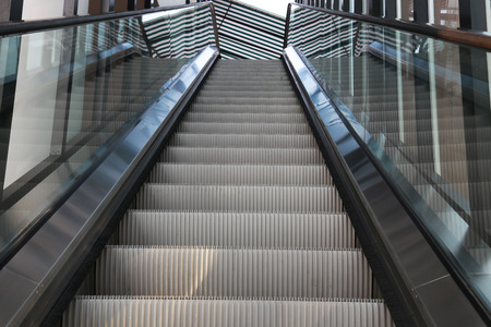 escalators and stairs in office building interior