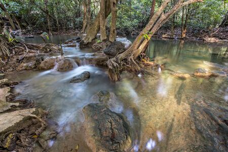 tropical waterfall in deep forest of Kanchanaburi province, Thailand.の写真素材