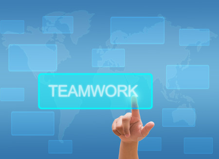 hand touching "teamwork" on virtual screen interfaceの写真素材