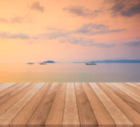 wooden floor and beautiful sunset or sunrise blurred backgroundの写真素材