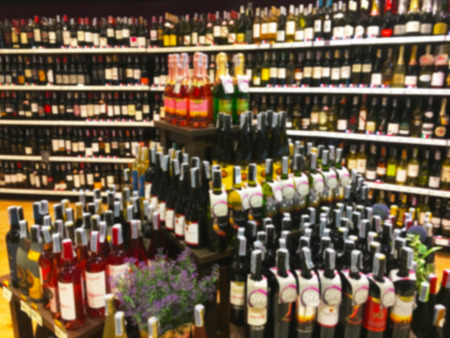 Wine Liquor bottle on shelf blurred backgroundの写真素材