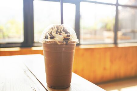 Iced chocolate on wood table with blurred backgroundの写真素材