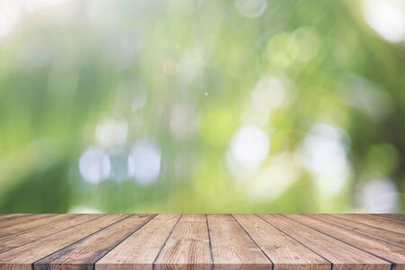 Abstract spring or summer with bokeh background and wooden tableの写真素材