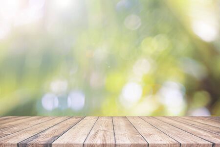 Abstract spring or summer with bokeh background and wooden tableの写真素材