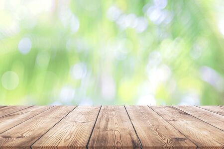 Abstract spring or summer with bokeh background and wooden tableの写真素材