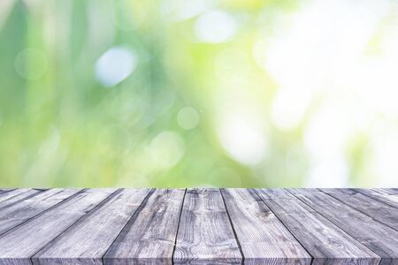 Abstract spring or summer with bokeh background and wooden tableの写真素材