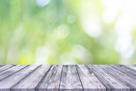 Abstract spring or summer with bokeh background and wooden tableの写真素材