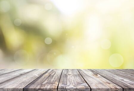 Abstract spring or summer with bokeh background and wooden tableの写真素材