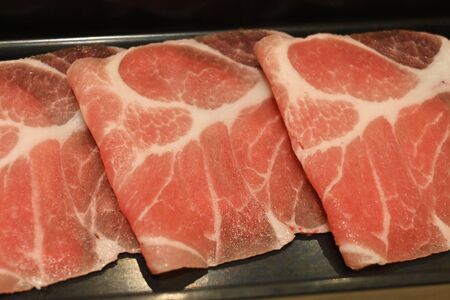 Close Up with Sliced Pork for Shabu and Sukiyakiの写真素材