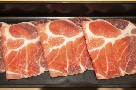 Close Up with Sliced Pork for Shabu and Sukiyakiの写真素材