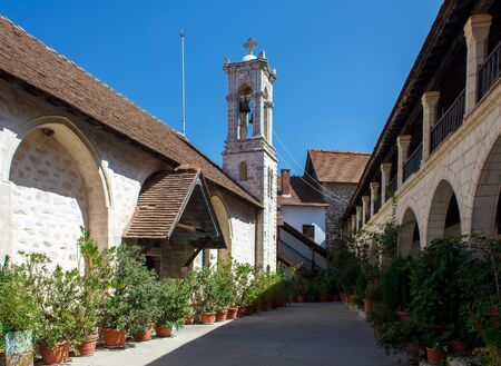 Panagia Chrysorrogiatissa monastery, Cyprus. Green courtyard and belfry of old monastery.の写真素材