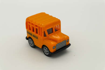 Vintage toy school bus on white background
