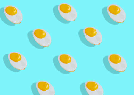 pattern made from scrambled eggs, fried eggs in a minimalistic pattern. Bright trend backgroundの写真素材