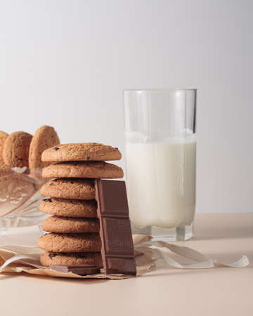 Oatmeal cookies with chocolate chunks and milk in a glass. Delicious healthy breakfast. stock photographyの写真素材