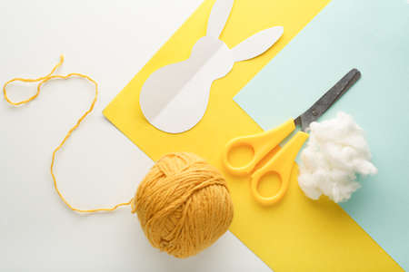 Step-by-step creation of a garland of bunnies. DIY concept. DIY decoration for the Easter holiday.の写真素材