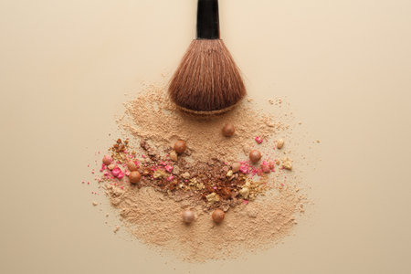 close up of a make up powder and make up brush on a pastel backgroundの写真素材