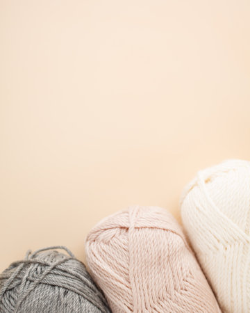 Three skeins of yarn with meth for text. Nice photo for a hobby, vertical orientation. Hobby...