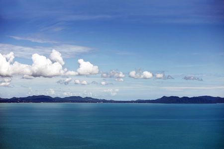 blue seascape with remote mountains on horizon. Thailand Islandの写真素材