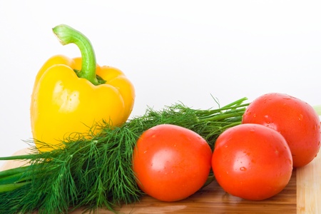 fresh vegetables on wood plateの写真素材