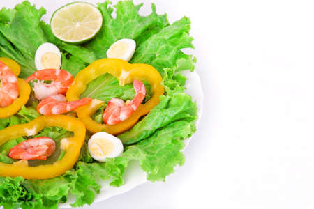 Vegetable, shrimp and eggs salad on a plate. Delicious eatingの写真素材