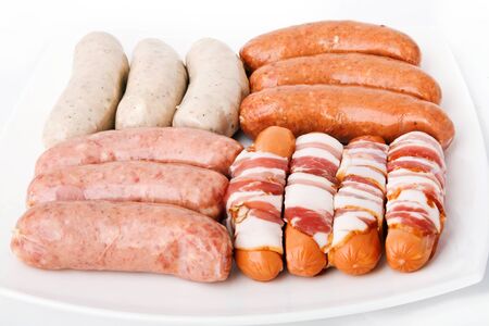  Some kind sausages on white plateの写真素材