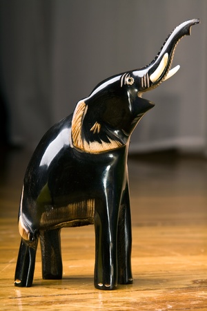 handmade wooden elephant statuette in the workshopの写真素材