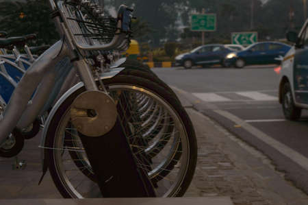 Indian smart bikes stand on the side of the road at eveningの写真素材