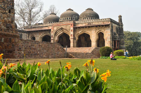A bada gumbad monument at lodi garden or lodhi gardens in a city park from the side of the lawn at winter foggy morning.の写真素材
