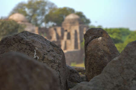 A mesmerizing view of hauz khas lake and garden from the hauz khas fort at hauz khas village at winter foggy morning.の写真素材