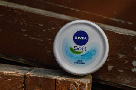 A product of nivea which is moisturize your skin indian product isolated on dusty wooden at morningのeditorial素材