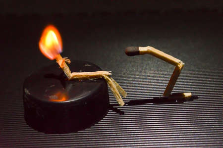 A miniature art of matchsticks in form of a people on top of table.の写真素材