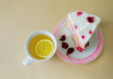 Piece of cake with tea. Tea with lemonの写真素材