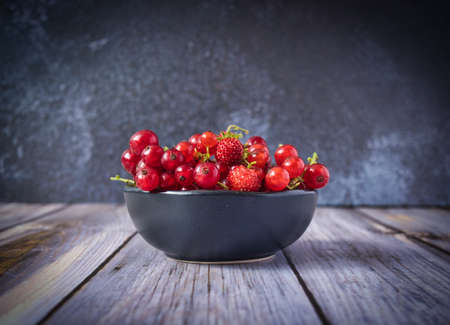 a bowl of fresh red berries