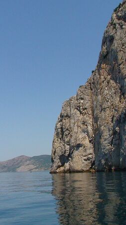 Rock in the sea not a background of the blue skyの写真素材