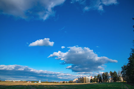 Not a big city church not far from the city in the field.の写真素材