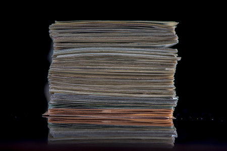 A lot of American dollars banknotes on a dark background.