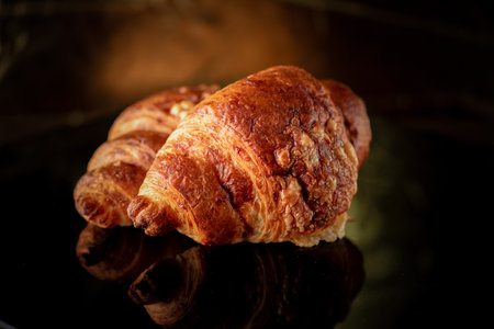 Delicious organic fresh homemade croissant on a dark background.の写真素材