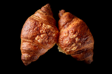 Delicious organic fresh homemade croissant on a dark background.の写真素材