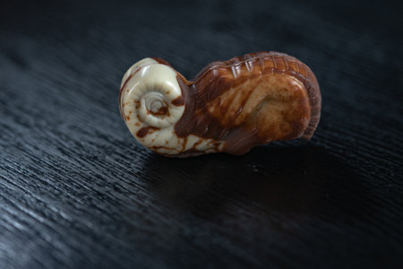 Figures of chocolate on a dark background.
