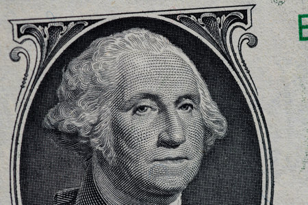Fragment of one American dollar banknote close-up.